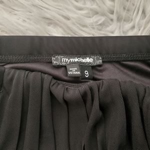 Black full length strapless formal.